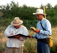 THC archeologists Randy Vance (left) and Brett Cruse use a Global Positioning system receiver to record the locations of artifacts. Photo courtesy of the Texas Historical Commission.
